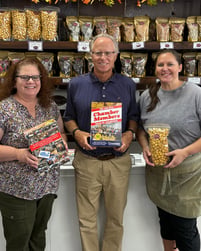 Chamber employees with Dan showing Cracker Jack Box made with custom designed packaging by Ashtonne Packaging
