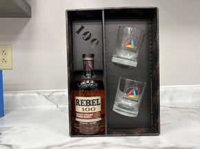 Rebel 100 bottle and 2 glasses- custom designed distillers packaging