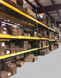 Shipping area boxes with floor painted- storing custom designed packaging for our customers